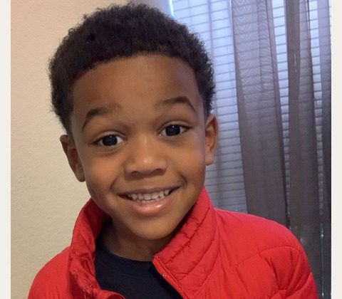 A smiling boy — original photo